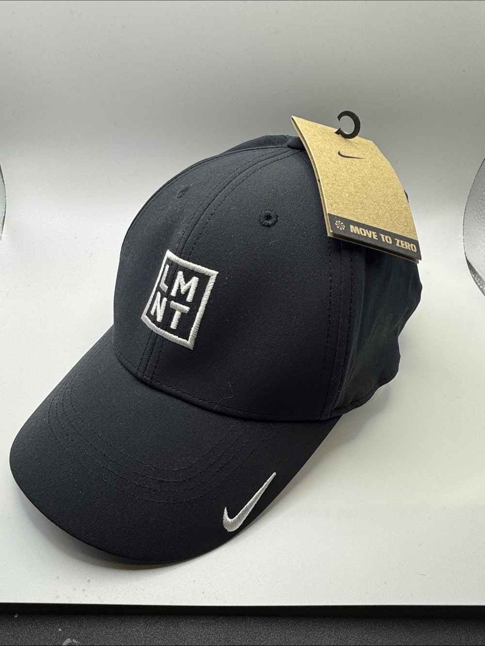 Nike Black LMNT Logo Baseball Hat with White Swoosh
